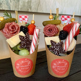 Charcuterie cups with meat, cheeses, fruit, nuts, olives, pickles and accompaniments in a single-serve cup. 14 oz. option.
