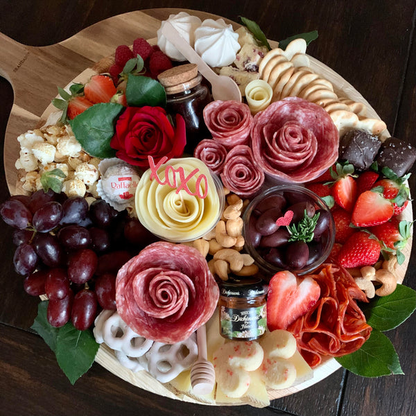 Charcuterie meats, cheeses, fruit, nuts, olives, pickles and accompaniments on a platter. Serves 6-8 as appetizer portions. The Galentine for Valentine's Day.