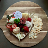 Charcuterie meats, cheeses, fruit, nuts, olives, pickles and accompaniments on a heart-shaped platter. Serves 1-2 as appetizer portions. The Graze-Gram for Valentine's Day.