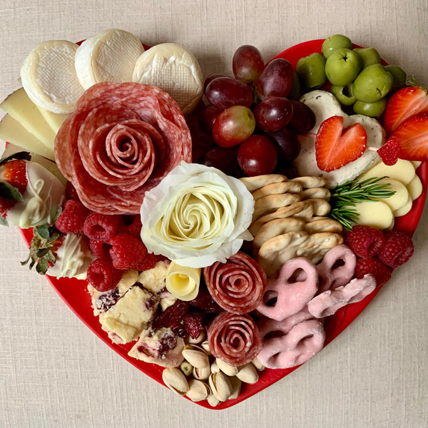 Charcuterie meats, cheeses, fruit, nuts, olives, pickles and accompaniments on a heart-shaped platter to keep. Serves 3-4 as appetizer portions. The Keepsake for Valentine's Day.